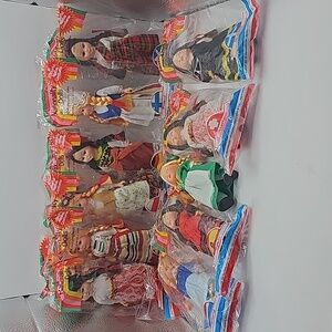 Nationality vintage dolls moving eyes arms and legs.